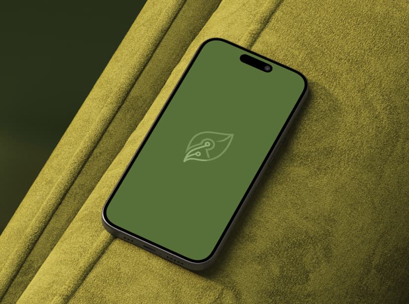 A cellphone with the ReLeaf logo rests on a couch